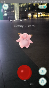 Pokemon Go gameplay image showing Pokeball being thrown at a Pokemon